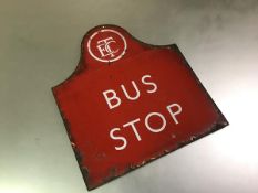 A vintage Edinburgh Corporation Transport Bus Stop sign, c. 1950, in red enamelled metal. 41cm by