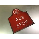 A vintage Edinburgh Corporation Transport Bus Stop sign, c. 1950, in red enamelled metal. 41cm by