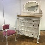 A French white-painted dressing chest and chair en suite, in the Neo-Classical taste, the oval