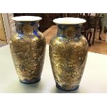 A pair of large Satsuma vases, Meiji period, c. 1900, each of baluster form, lavishly decorated in