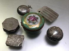 A group of small silver boxes comprising: a Victorian pill box, Birmingham 1897, of flattened