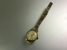 Gigandet, a Swiss lady's 18ct gold wristwatch, on a rolled gold bracelet strap. Diameter of case