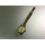 Gigandet, a Swiss lady's 18ct gold wristwatch, on a rolled gold bracelet strap. Diameter of case