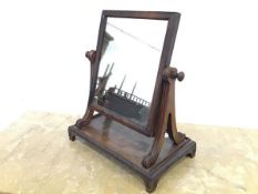 A Regency mahogany toilet mirror, attributed to Gillows, the rectangular plate within scroll