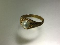 An early 20th century pearl ring, the pearl (approx. 5.5mm diameter) claw-set on an 18ct yellow gold