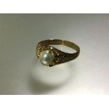 An early 20th century pearl ring, the pearl (approx. 5.5mm diameter) claw-set on an 18ct yellow gold