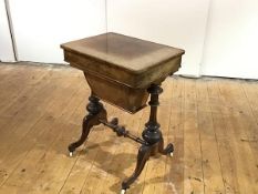 A Victorian figured walnut work table, the hinged rectangular top enclosing a fitted interior, above