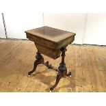 A Victorian figured walnut work table, the hinged rectangular top enclosing a fitted interior, above