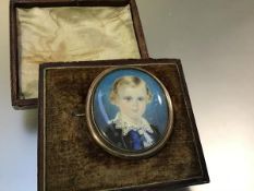 English School, 19th Century, a portrait miniature of Master Edward Bird, mounted as a brooch,