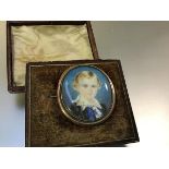 English School, 19th Century, a portrait miniature of Master Edward Bird, mounted as a brooch,