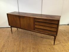 A Danish rosewood sideboard, c. 1960, the rectangular top above a bank of four drawers and a pair of