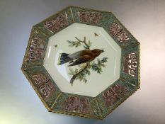 A French porcelain cabinet plate in the Aesthetic taste, c. 1880, octagonal, painted to the well