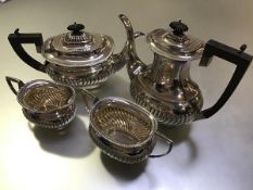 A George V four piece silver tea and coffee service, Williams (Birmingham) Ltd, Birmingham 1911,