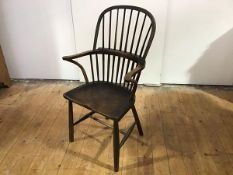 A small oak and elm hoop back Windsor armchair, 19th century, the stick back above a saddle seat