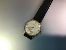 A vintage Tissot gentleman's 9ct gold-cased wristwatch, c. 1960, the dial with baton and Arabic