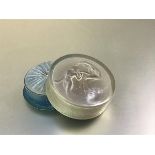 A Lalique opalescent glass powder jar, c. 1930, for D'Orsay, in the Ondines pattern, with moulded