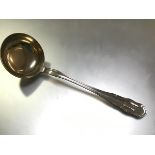 A substantial German 800 silver soup ladle, c. 1900, with gilt bowl and shaped thread handle,