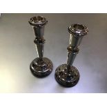 A pair of silver candlesticks in 19th century style, W.I. Broadway & Co., Birmingham 1977, of