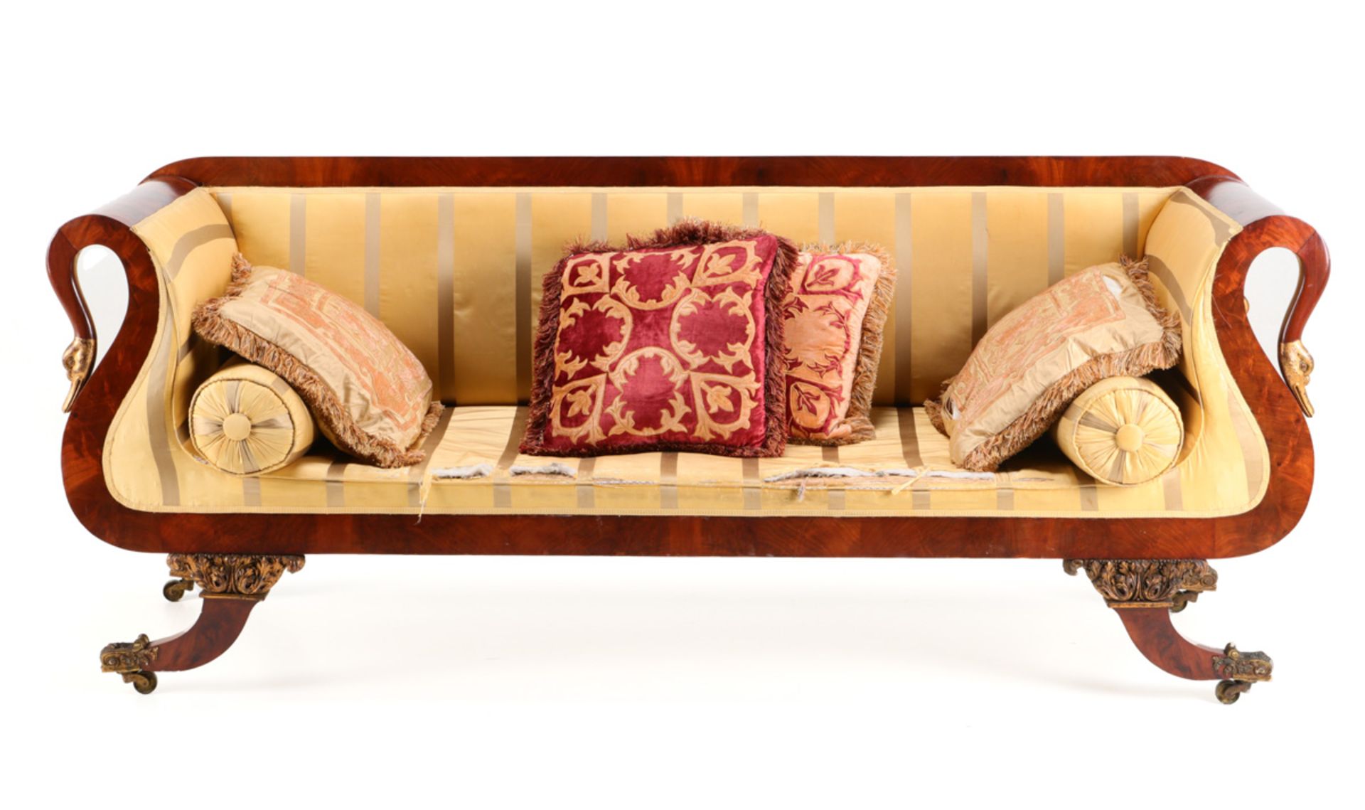 A REGENCY SOFA Cuban mahogany, arms ending in gilded swans heads. Silk lined. Zoomorphic bronze feet