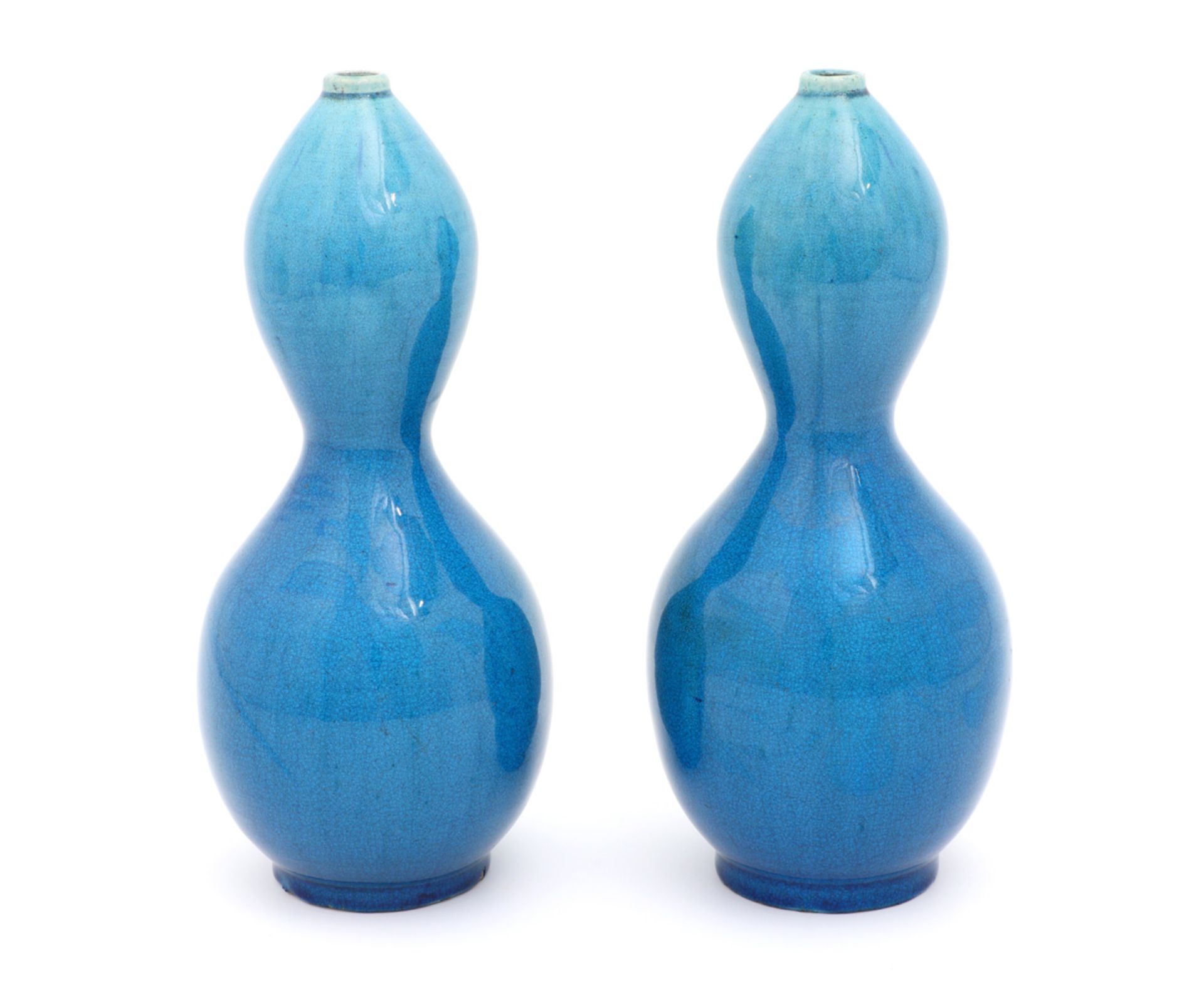 A PAIR OF VASES Oriental ceramic, blue monochrome. Marked. One with slight firing defect. Height: