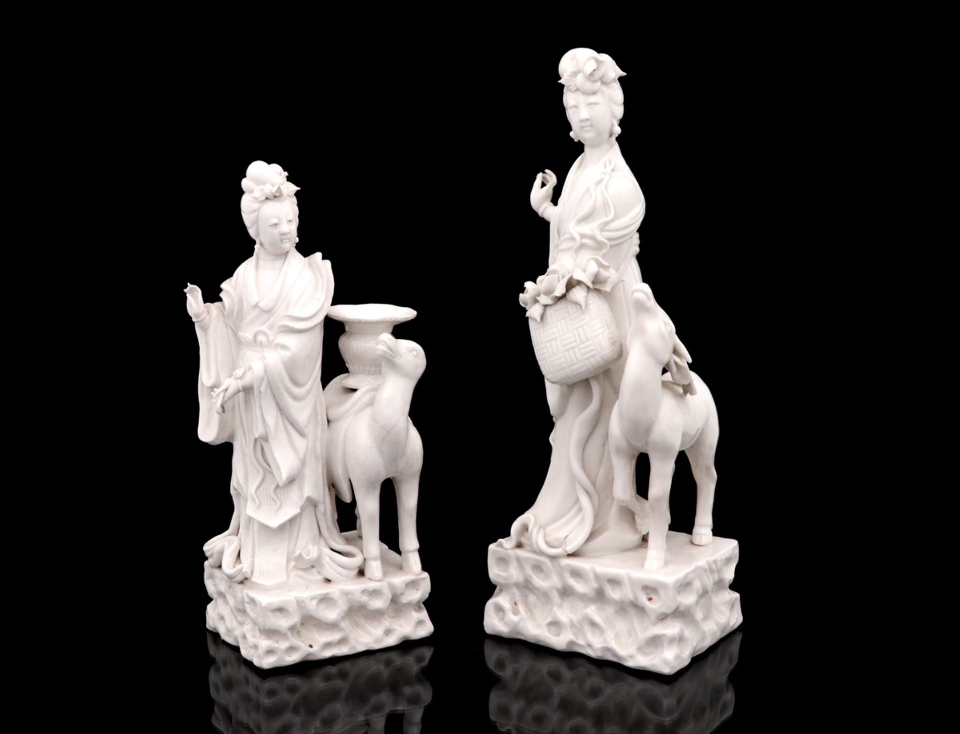 A PAIR OF CHINESE PORCELAIN GUANYINS Chinese porcelain, 20th Century, blanc-de-chine. Losses and