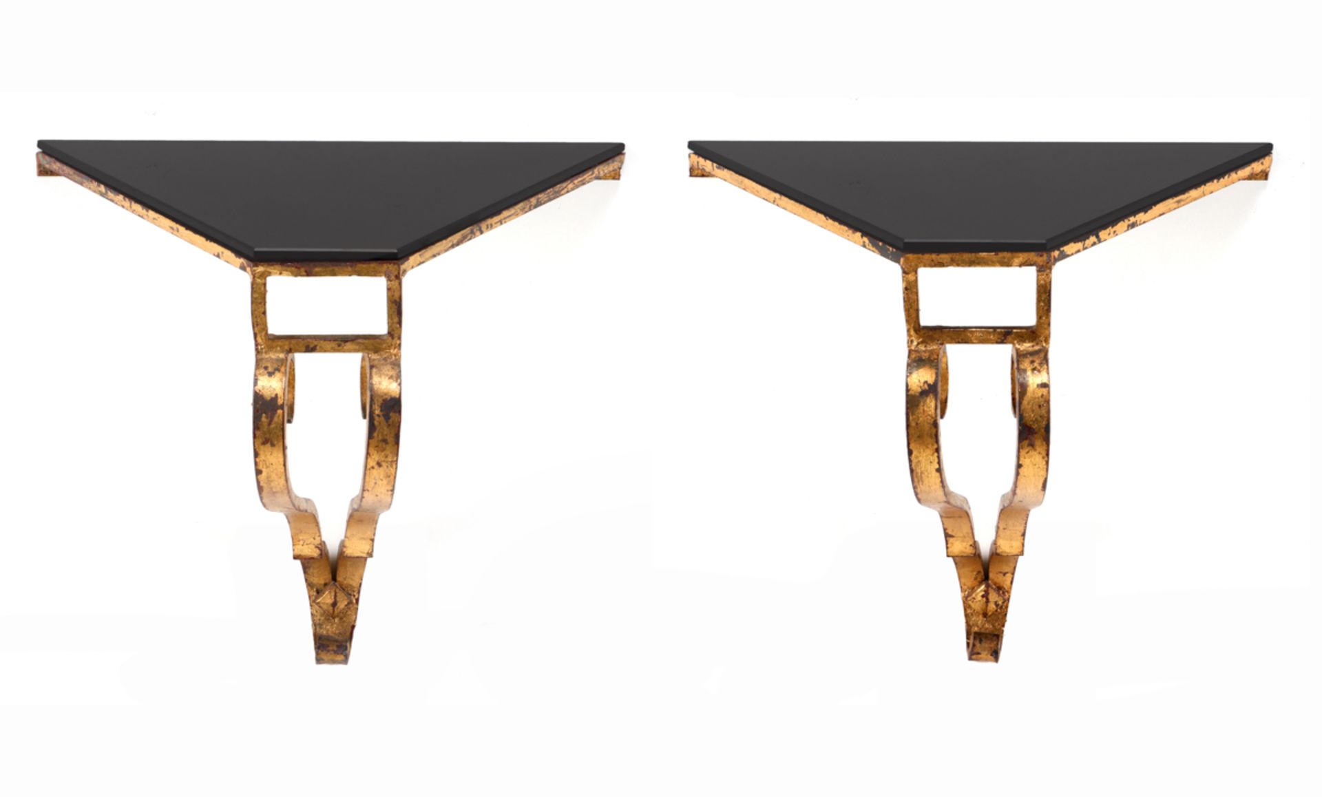 A PAIR OF WALL BRACKETS Gilt iron and dark glass. France, 1930's/1940's. Dim.: 33x35x23 cm.