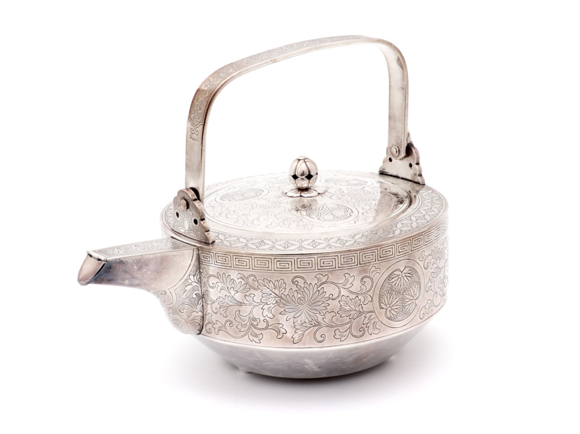 A MEIJI SILVER TEAPOT Silver, engraved decoration depicting Oriental motifs, Japanese work, Meiji