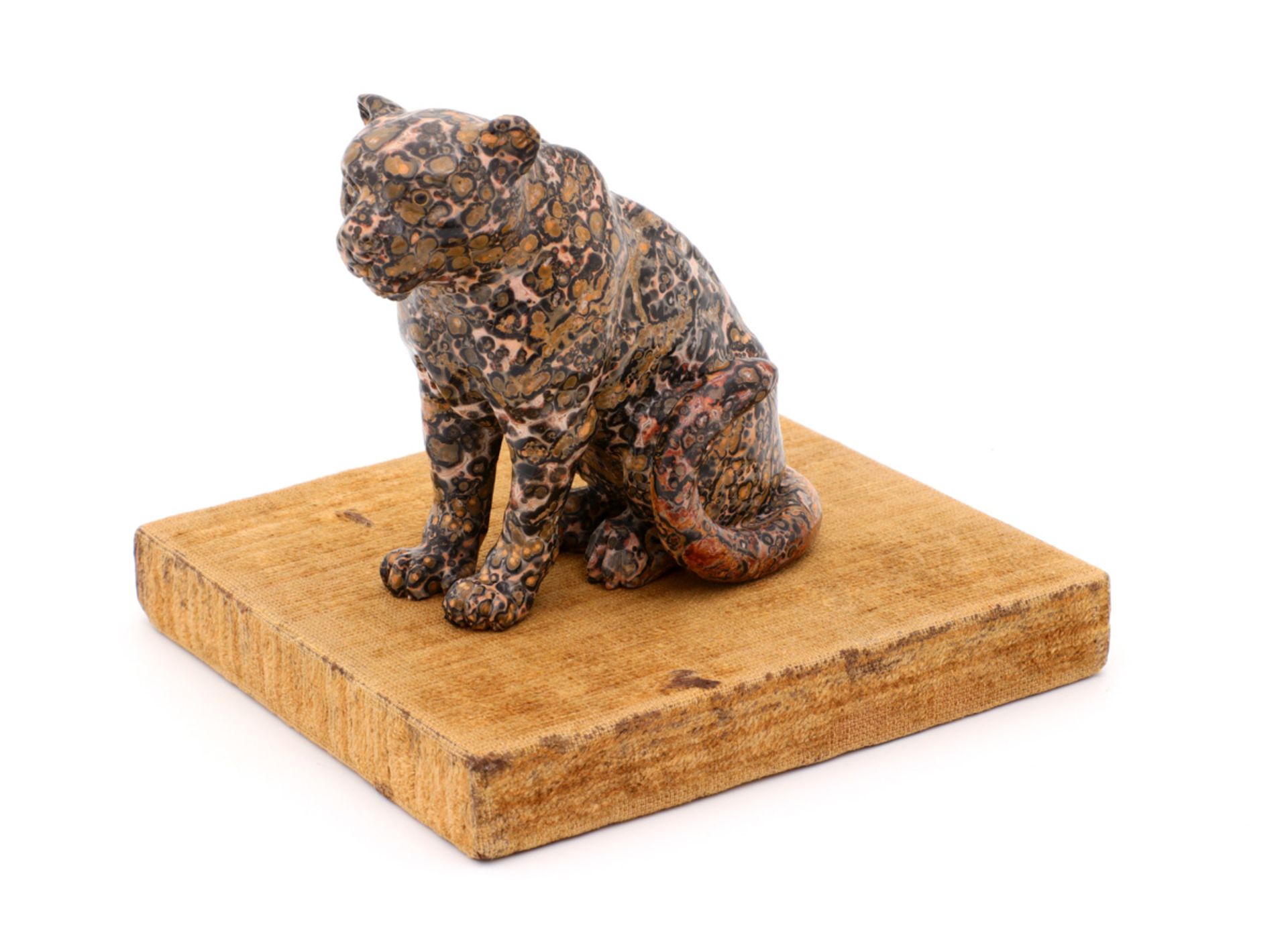 A LEOPARD IN "GIALLO TIGRATO" Carved "giallo tigrato" marble, glass eyes, in the style of Antonio