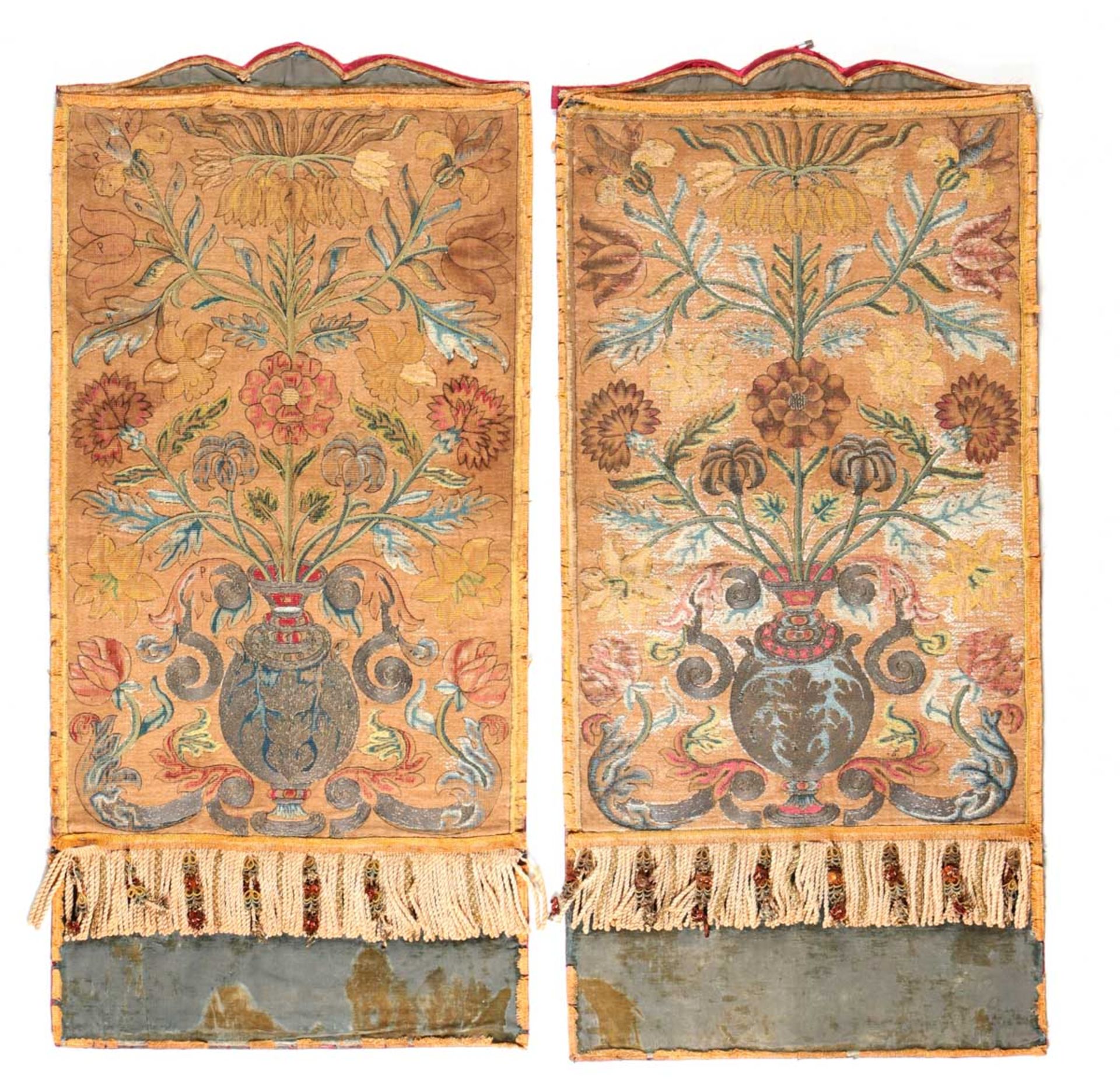 A PAIR OF ITALIAN CLOTHES Profusely embroided, depicting vases and foliage. Blue velvet bases on red