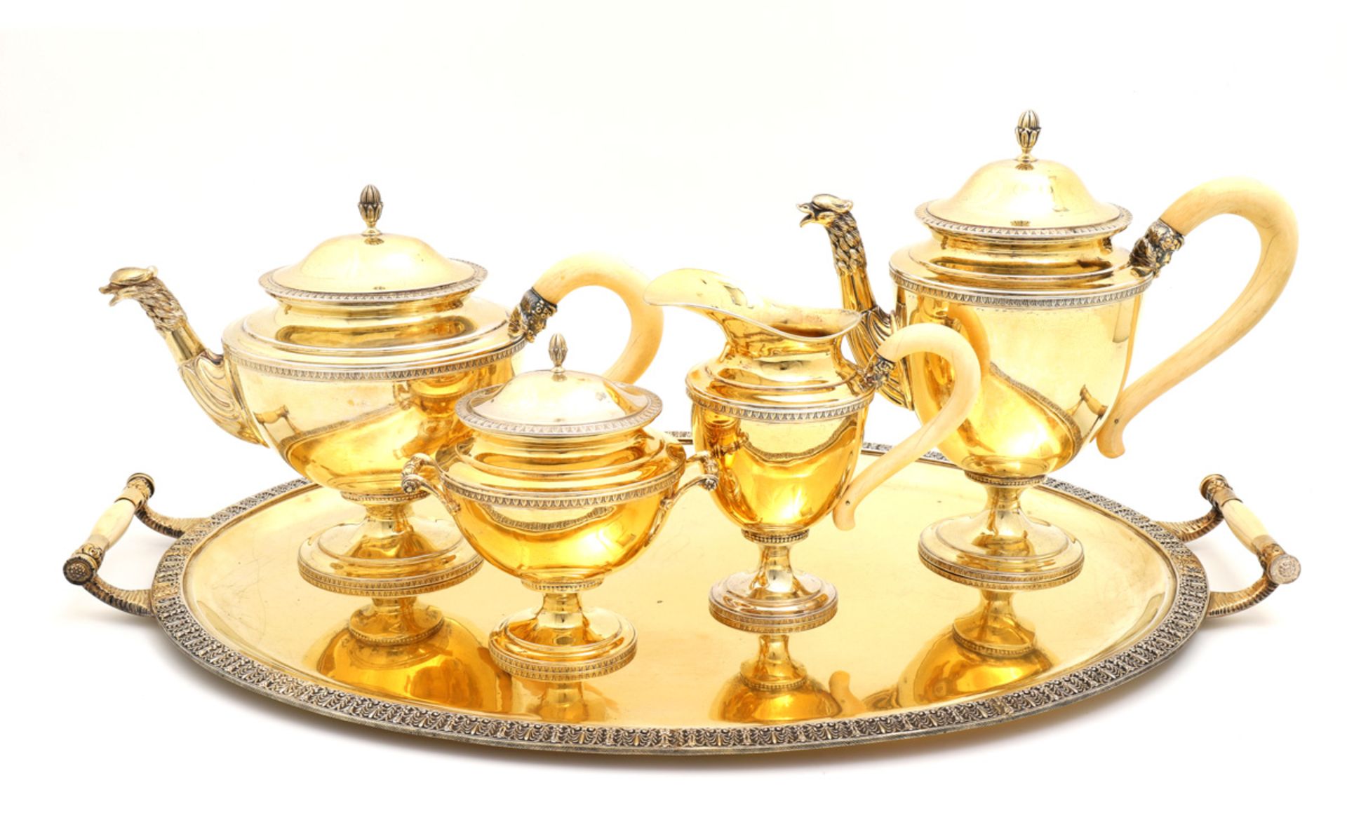 A VERMEIL TEA AND COFFEE SET Comprising: tray, coffee pot, teapot, milk jug and sugar bowl. 800/