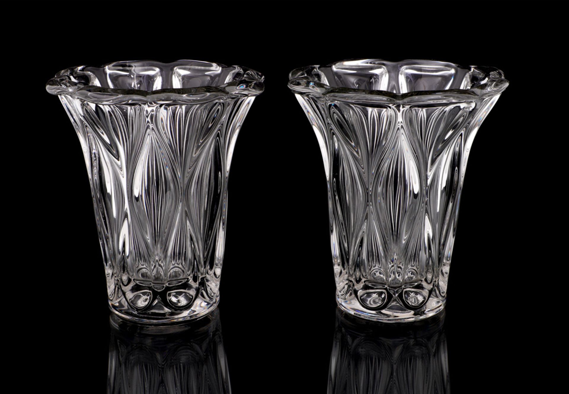 A PAIR OF CRYSTAL VASES Molded crystal, attributable to André Thuret. Height: 19 cm.
