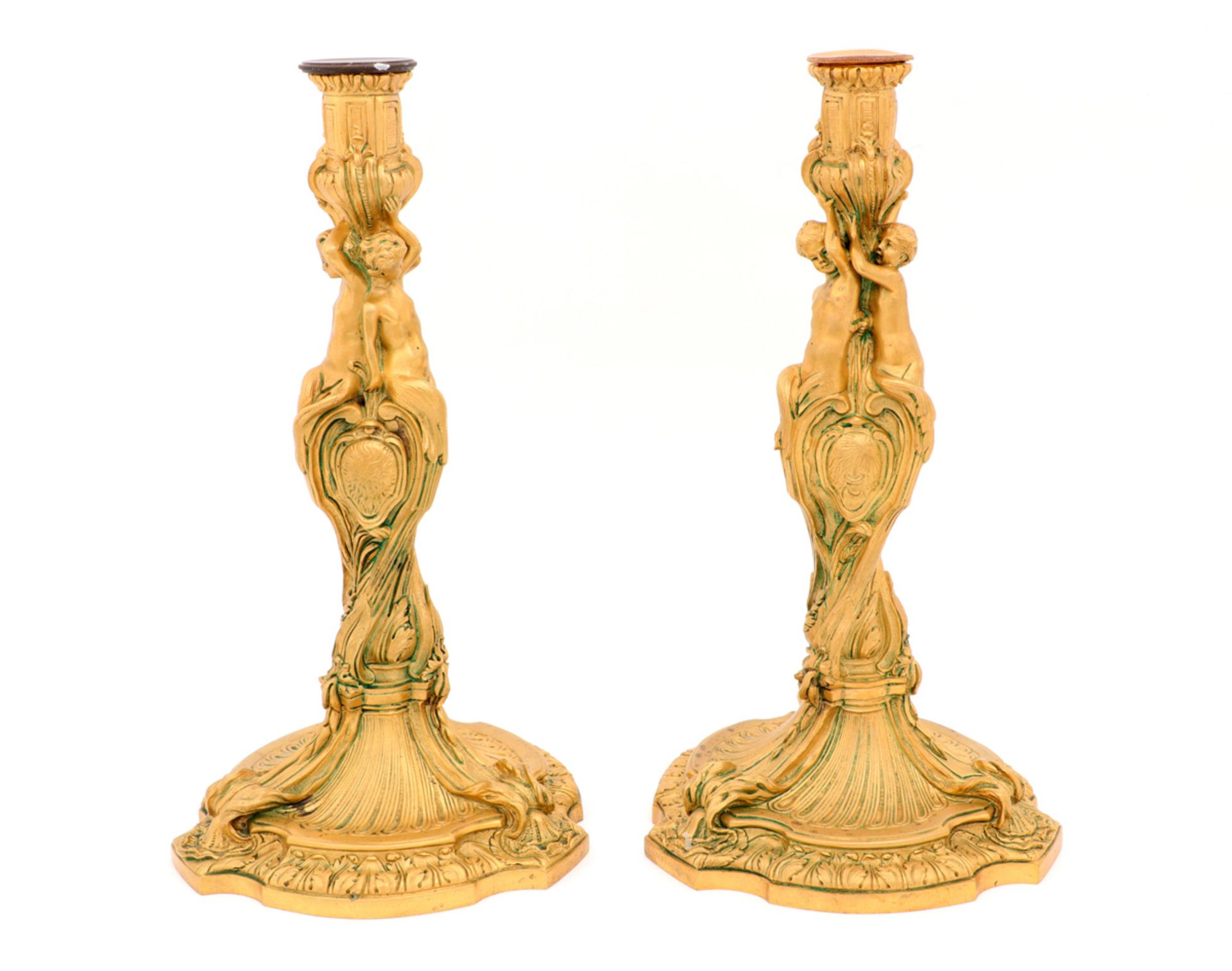 A PAIR OF LOUIS XV STYLE CANDLESTICKS Gilt bronze, profusely chiselled deoration, with coat of
