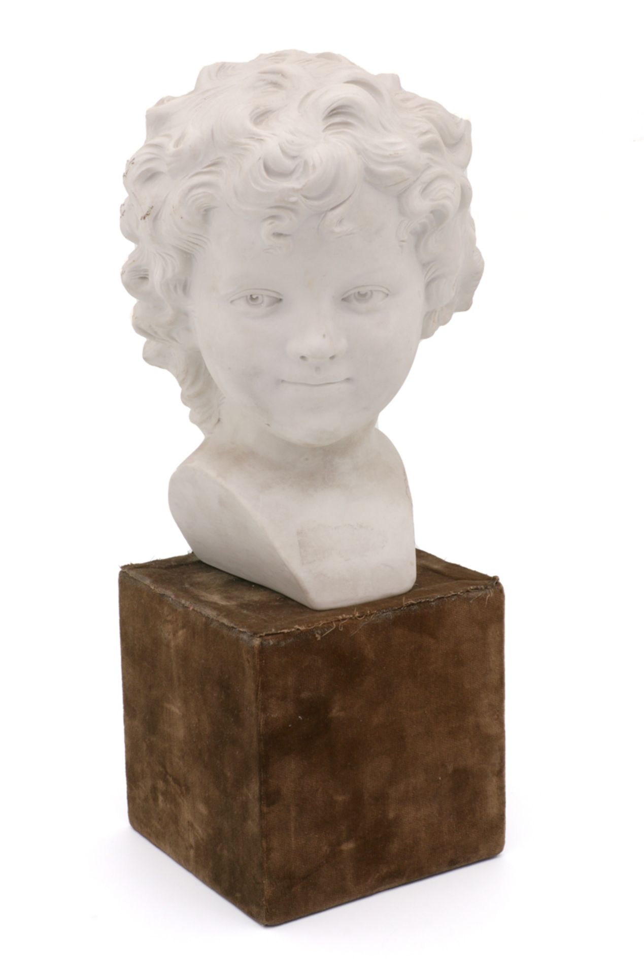 A CHILD'S HEAD French biscuit from Sèvres, late 19th Century. Marked and signed. Green velvet