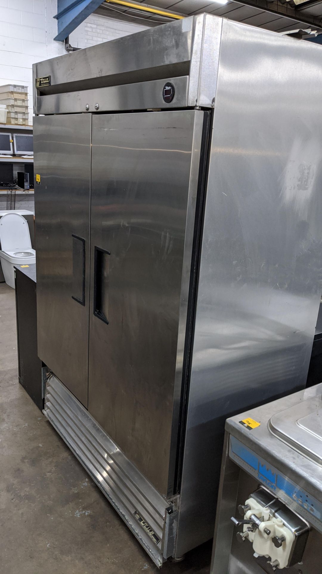 True Refrigeration stainless steel tall mobile twin door commercial fridge model T-49. IMPORTANT: