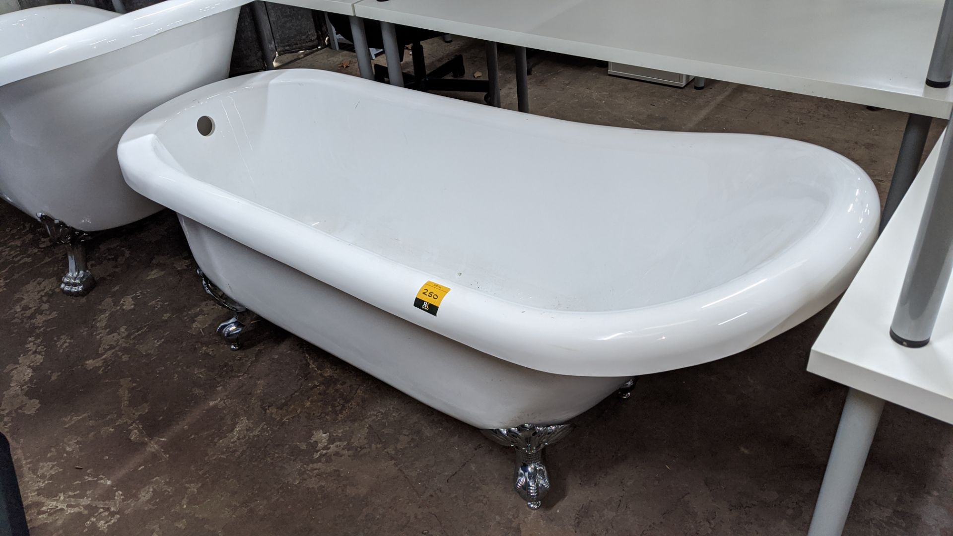 Traditional style bathtub with silver feet, circa 1680mm long. This is one of a number of lots