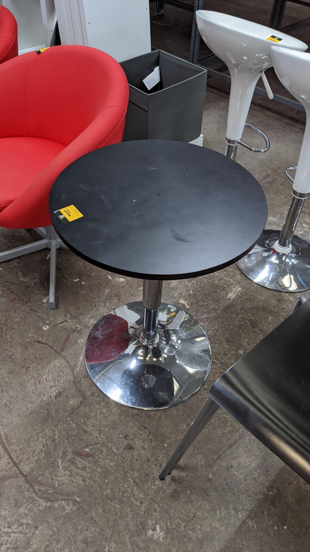 Small black round table on chrome single pedestal base, diameter of top circa 530mm. This is one