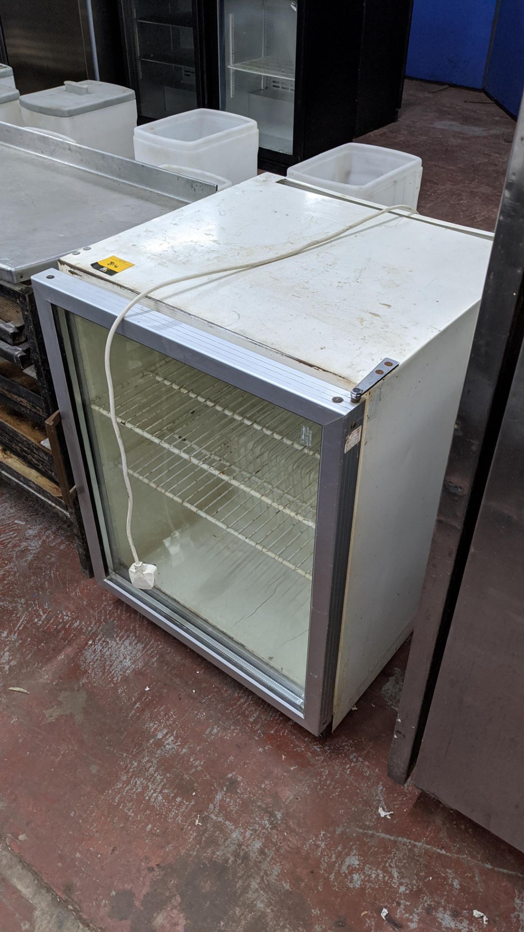 Clear front counter height fridge. Lots 813 - 815 are residual assets from a bakery in liquidation