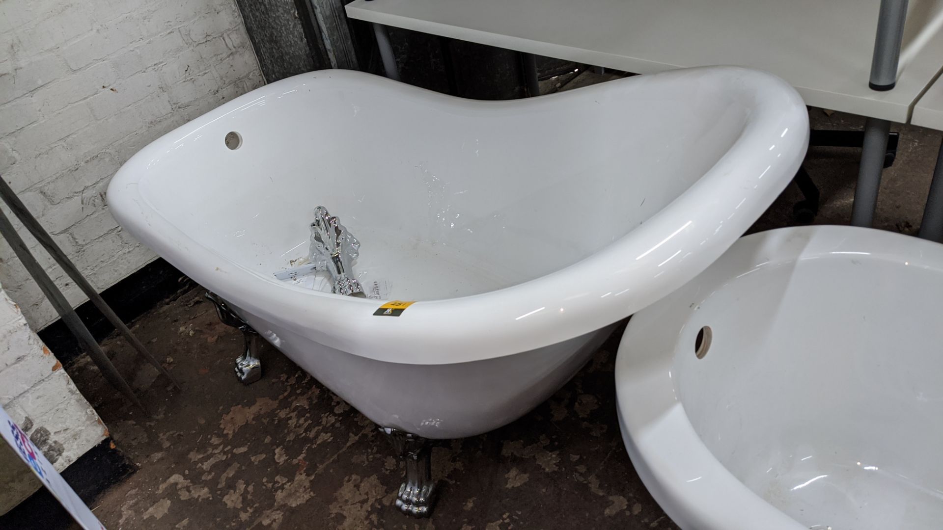 Traditional style high back bathtub with 4 off silver feet, circa 1600mm long. This is one of a