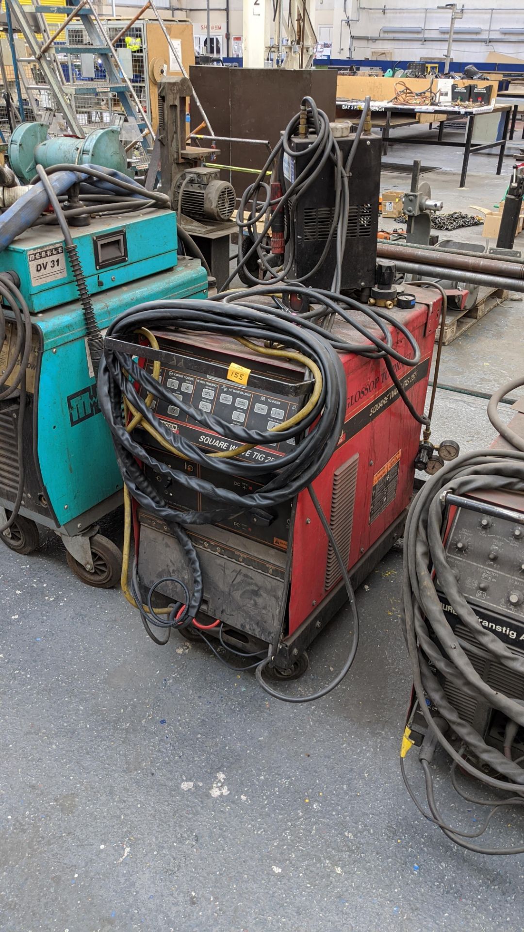 Lincoln Electric Square Wave TIG 255 welder plus feeder unit located on top of same as pictured