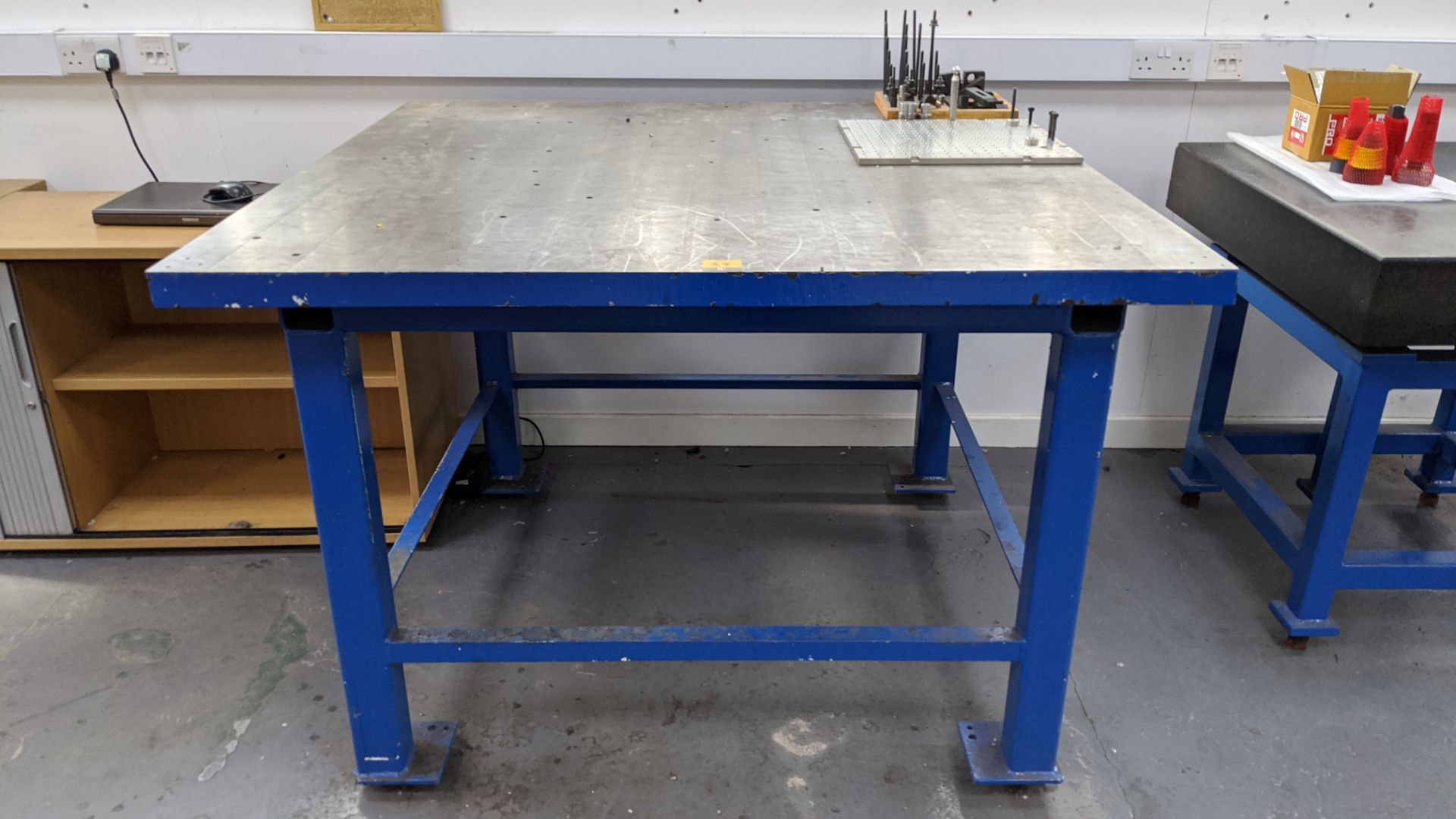 Heavy-duty metal inspection table with top measuring approx. 1377mm x 1377mm, including ancillary