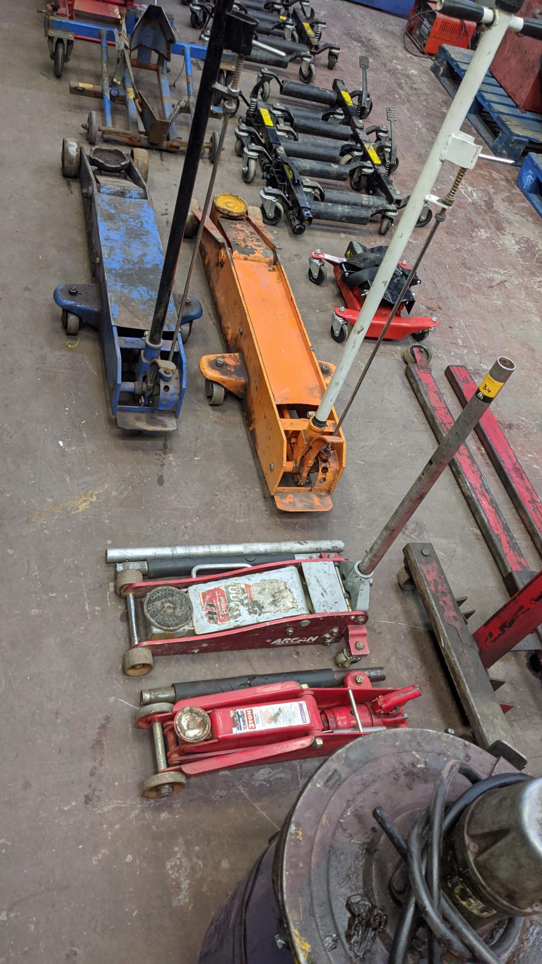 4 assorted trolley jacks, comprising 2 smaller jacks & 2 very large jacks. Lots 22 - 53 are all