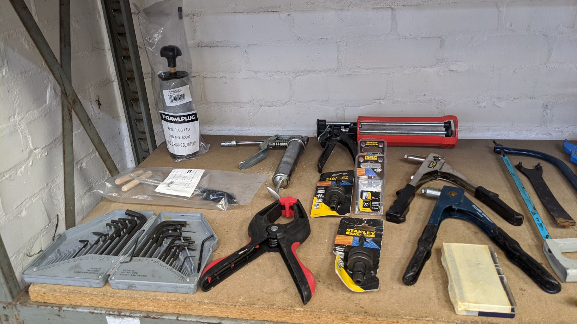 Contents of a shelf of assorted tools including Makita small & large angle grinders, suction - Image 8 of 9