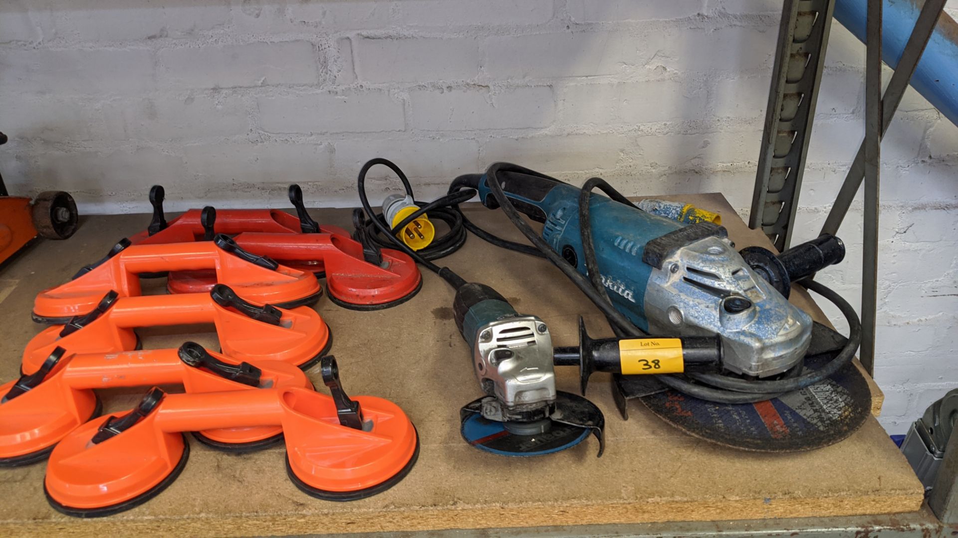 Contents of a shelf of assorted tools including Makita small & large angle grinders, suction - Image 3 of 9