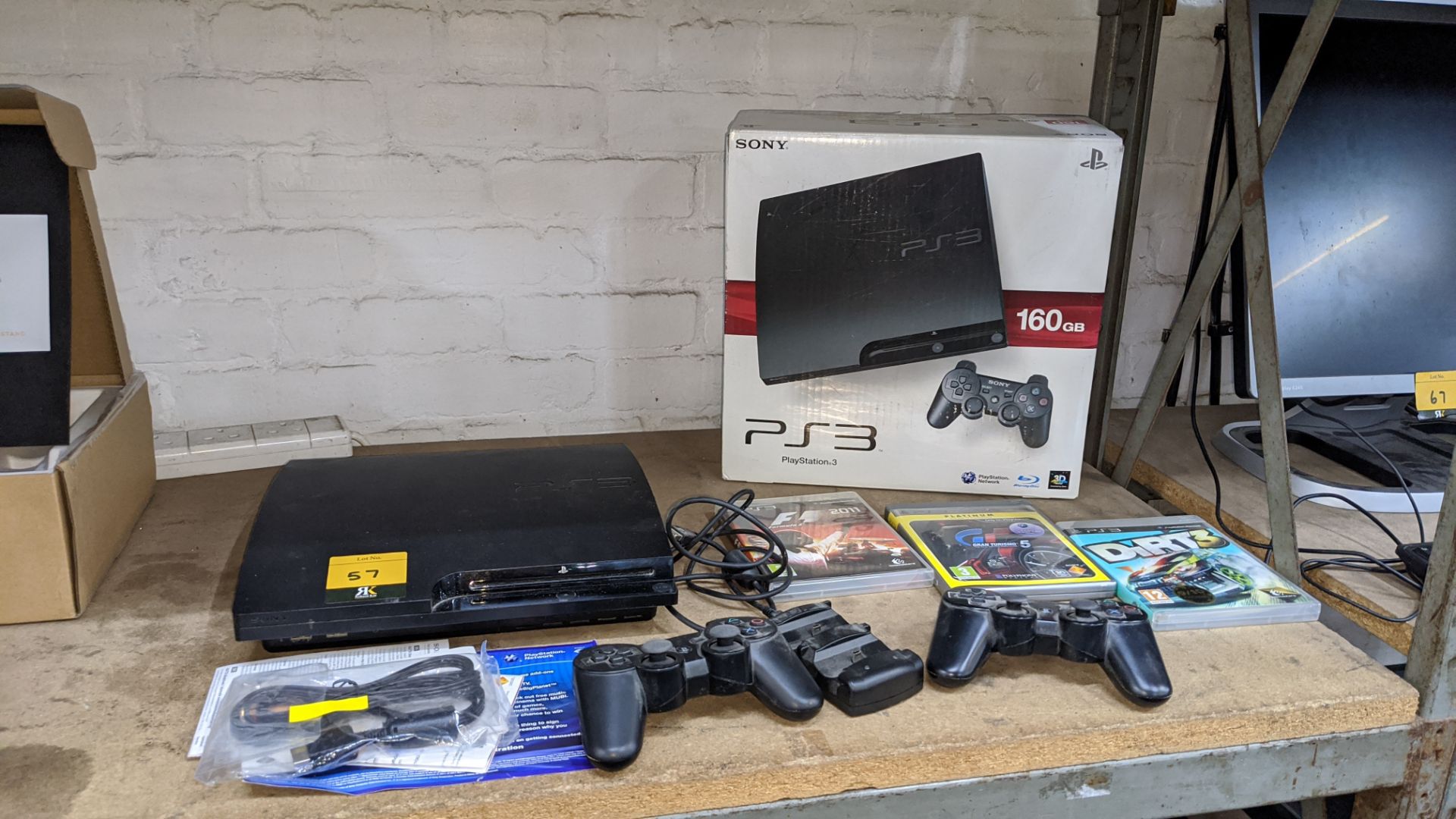 Sony PS3 gaming console, 160Gb, including 2 off Dual Shock 3 SIXAXIS wireless controllers and dock