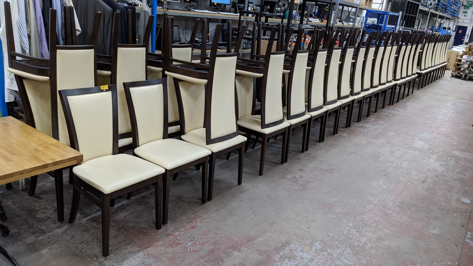 56 off matching chairs, in dark brown wood with off-white leather/leather look upholstery Lots