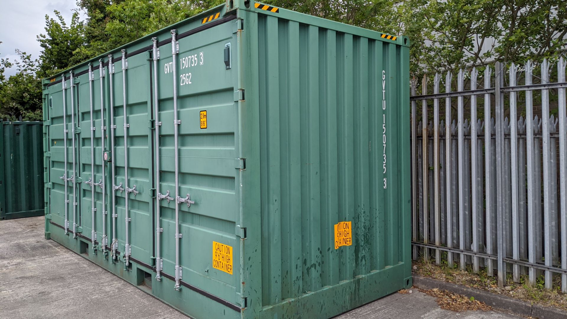 Metal shipping container, extra high (9'6 high), approx. 20' long x 8' wide. Set of regular doors at