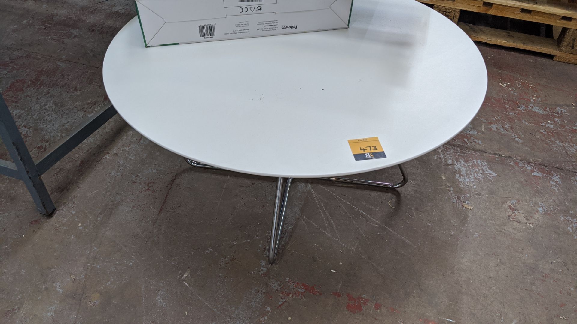 Low height round white table on chrome legs, diameter circa 750mm, height circa 370mm