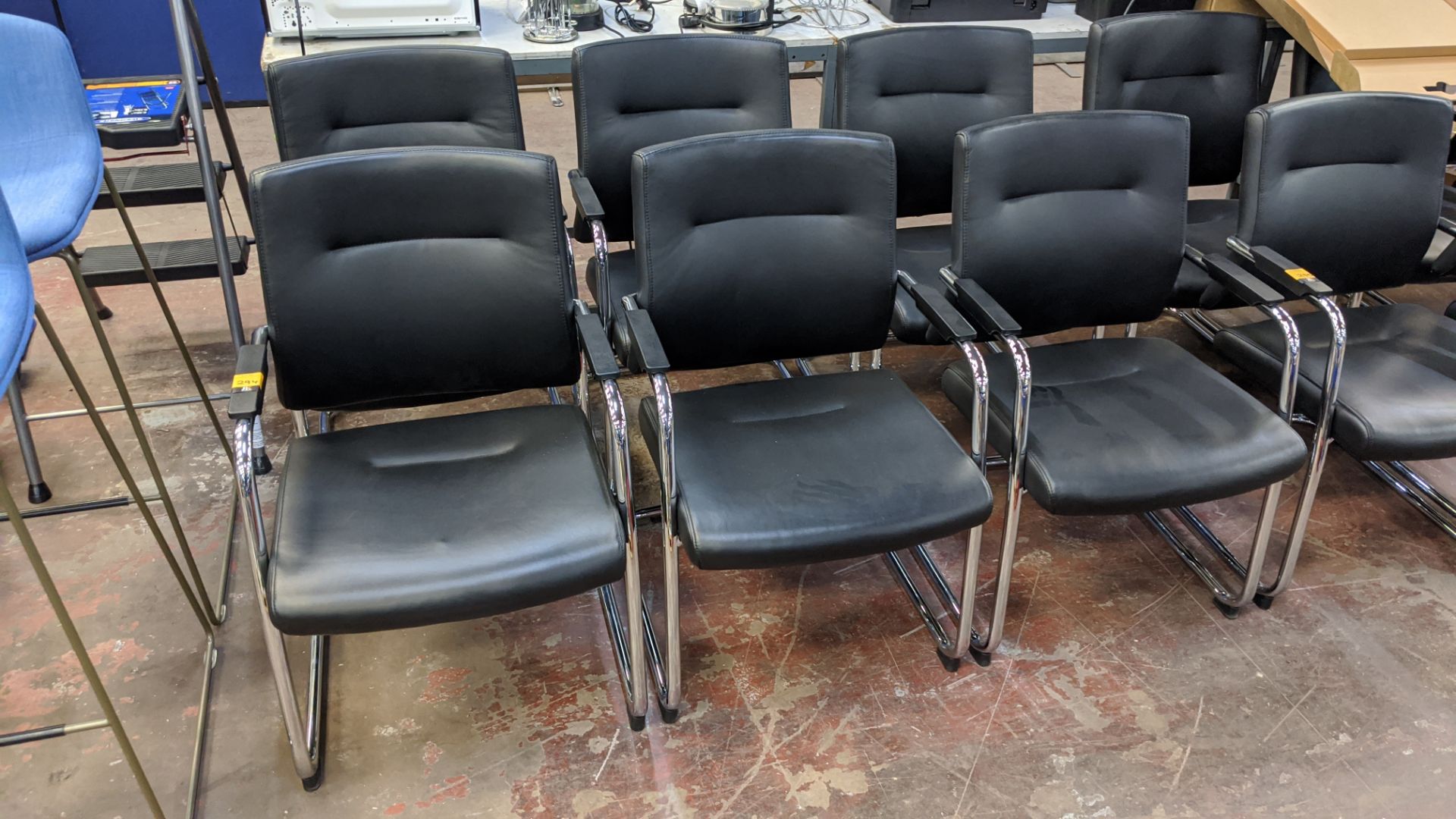 6 off matching black leather chairs on chrome bases NB. Lots 294 & 295 consist of different quantiti