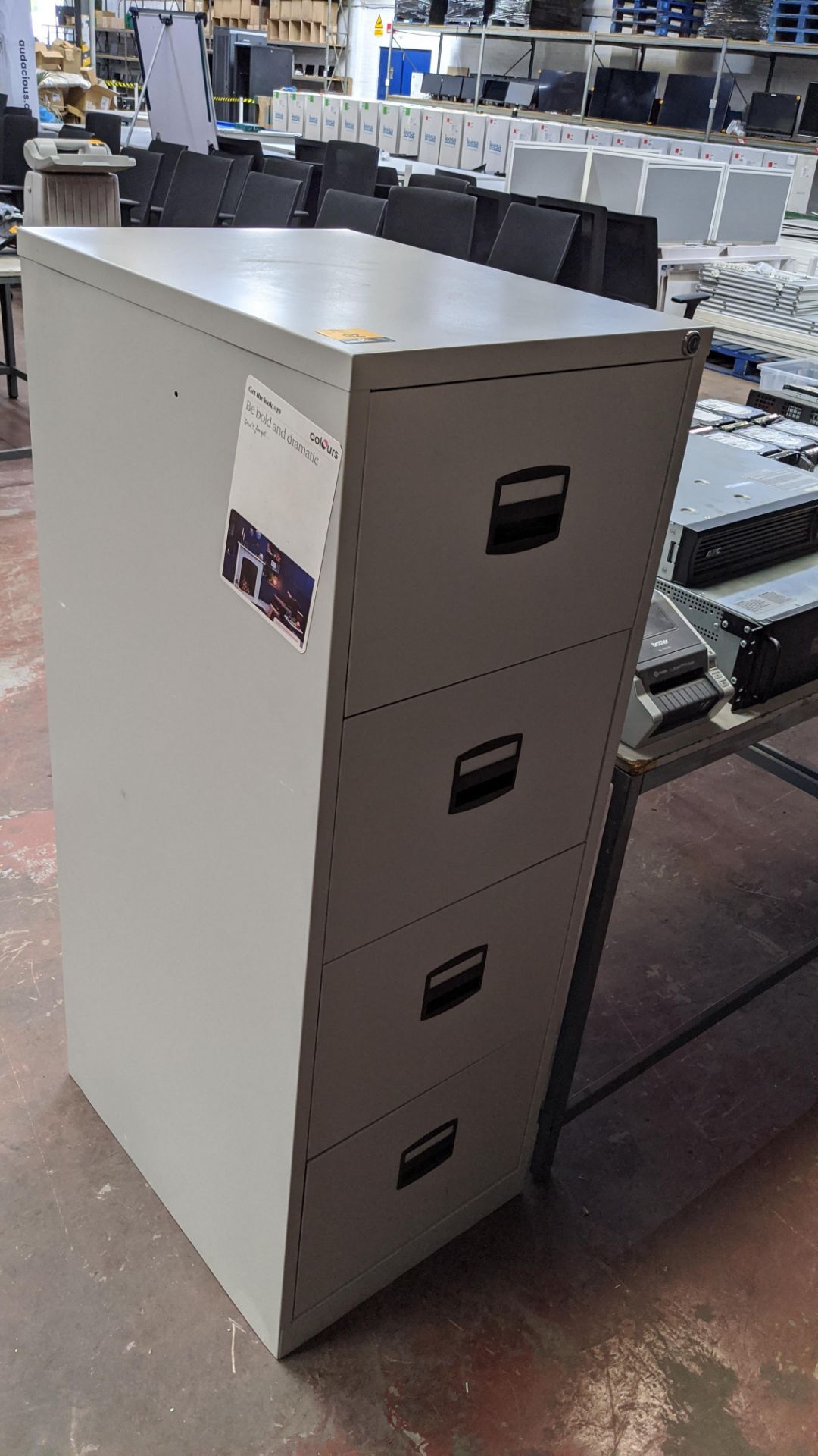 Grey metal 4-drawer filing cabinet