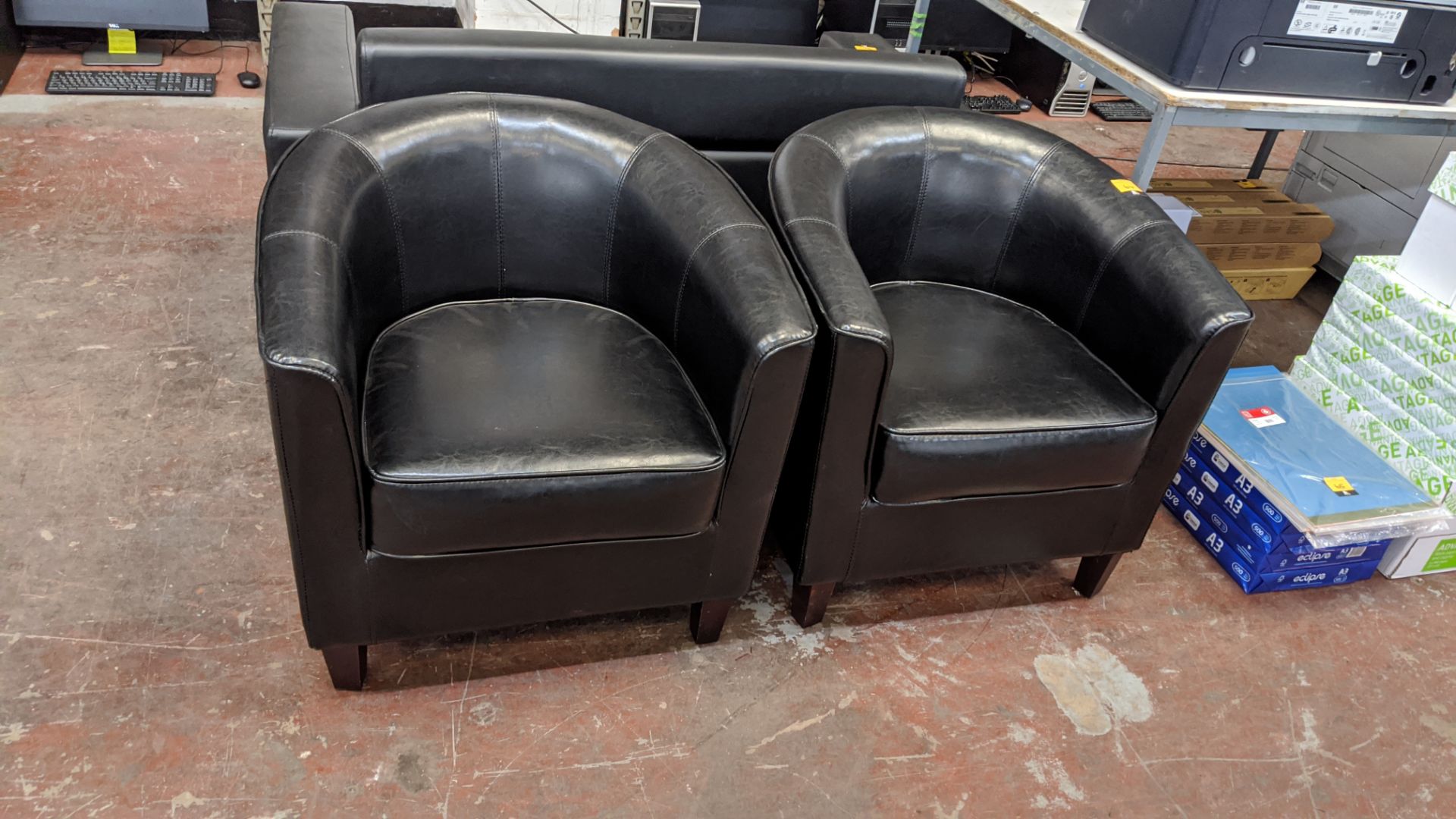 Pair of leather/leather look tub chairs